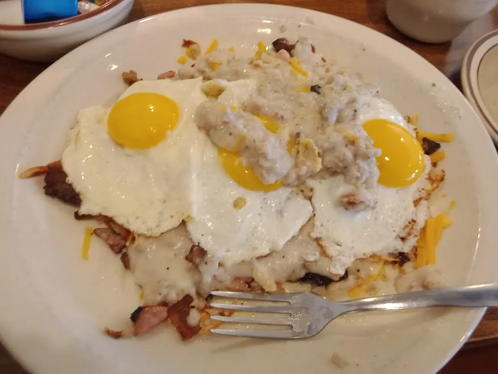 Off the Griddle Meat Lovers with Extra Gravy and Three Sunny Side Up Eggs